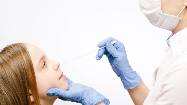  Child getting Nasal swab 