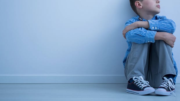 Child sitting sad 